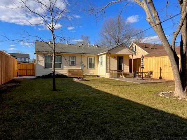 a view of a big yard next to a house