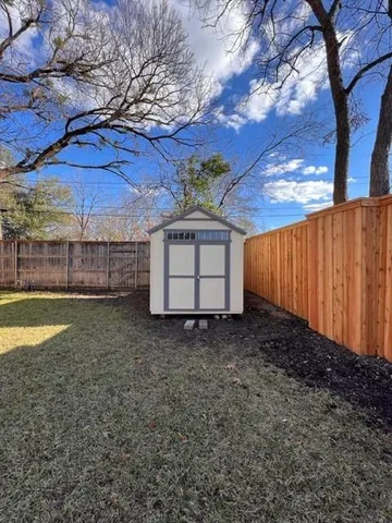 a house view with a backyard space