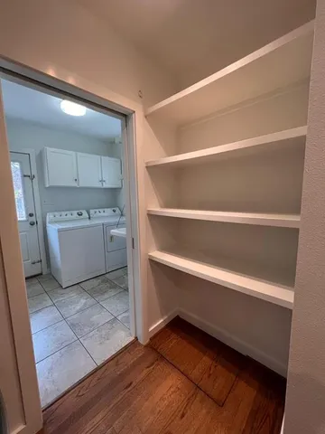 a room with a closet and a mirror