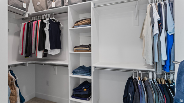 355 East Overlook Loop Hideout, UT 84036 - Photo 20 of 40 Custom Primary Suite closet system featuring white shelving, multiple hanging rods, corner storage, integrated shelving units, and overhead storage