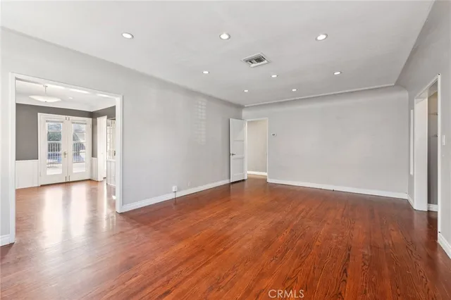 a view of an entryway with wooden floor