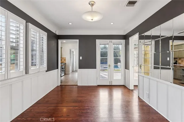 a kitchen with granite countertop a sink and cabinets