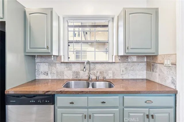 a view of a room with wooden floor and windows