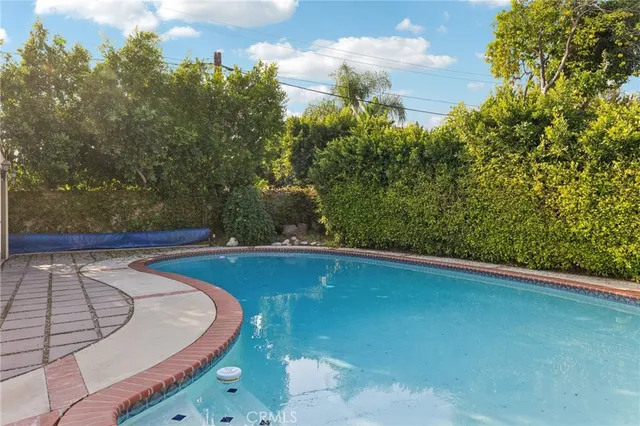 a view of a red building with a swimming pool