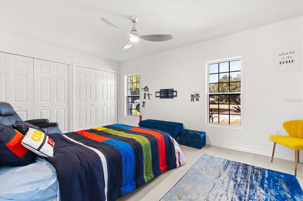 812 Chastain Road Seffner, FL 33584 - Photo 15 of 26 a bedroom with a bed and a window