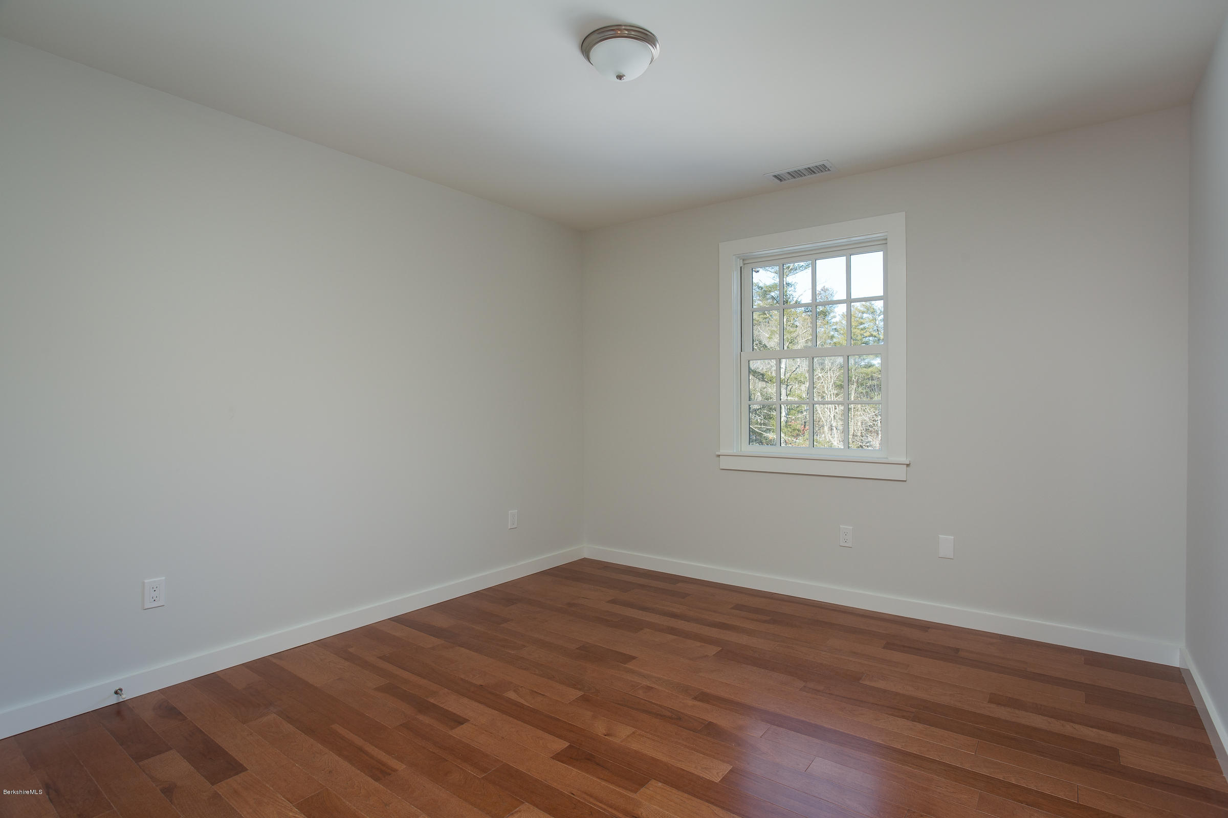 205 Main Road Monterey, MA 01245 - Photo 16 of 25 wooden floor in an empty room with a window