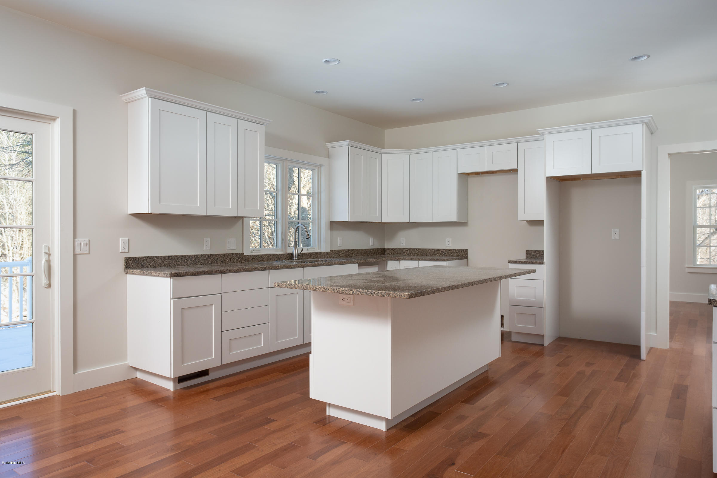 205 Main Road Monterey, MA 01245 - Photo 6 of 25 a kitchen with stainless steel appliances granite countertop a stove a sink and a refrigerator