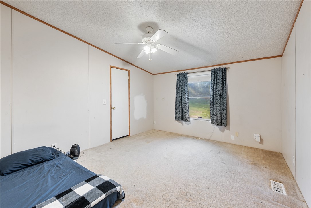 8277 Shady Lane Bryan, TX 77808 - Photo 14 of 21 a living room with furniture and a chandelier