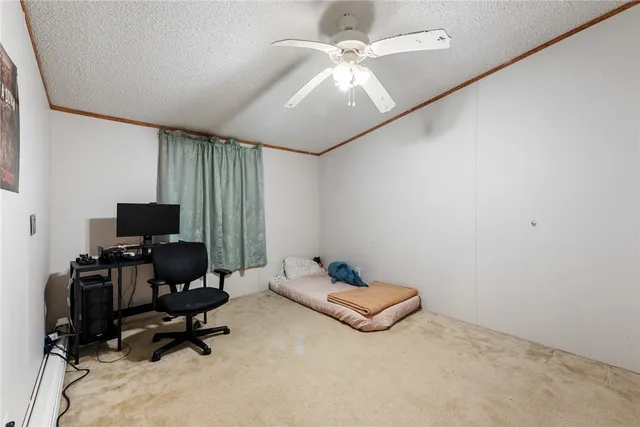 a bedroom with a workspace