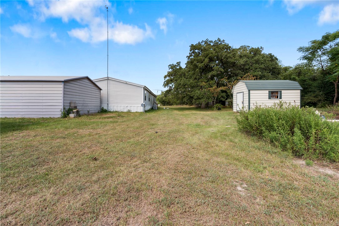 8277 Shady Lane Bryan, TX 77808 - Photo 20 of 21 a house with a yard