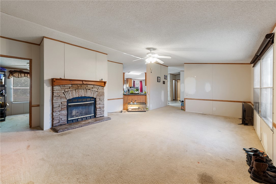 8277 Shady Lane Bryan, TX 77808 - Photo 3 of 21 a view of a livingroom with furniture and a fireplace