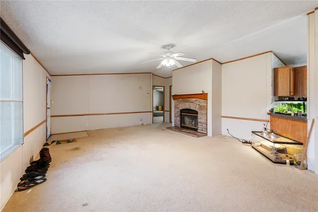 a view of a livingroom with furniture and a fireplace