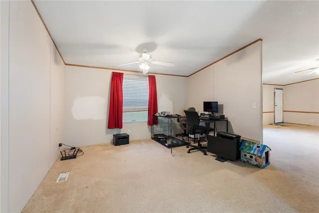 a room with gym equipment and a window