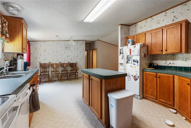 a kitchen with stainless steel appliances a stove and a refrigerator