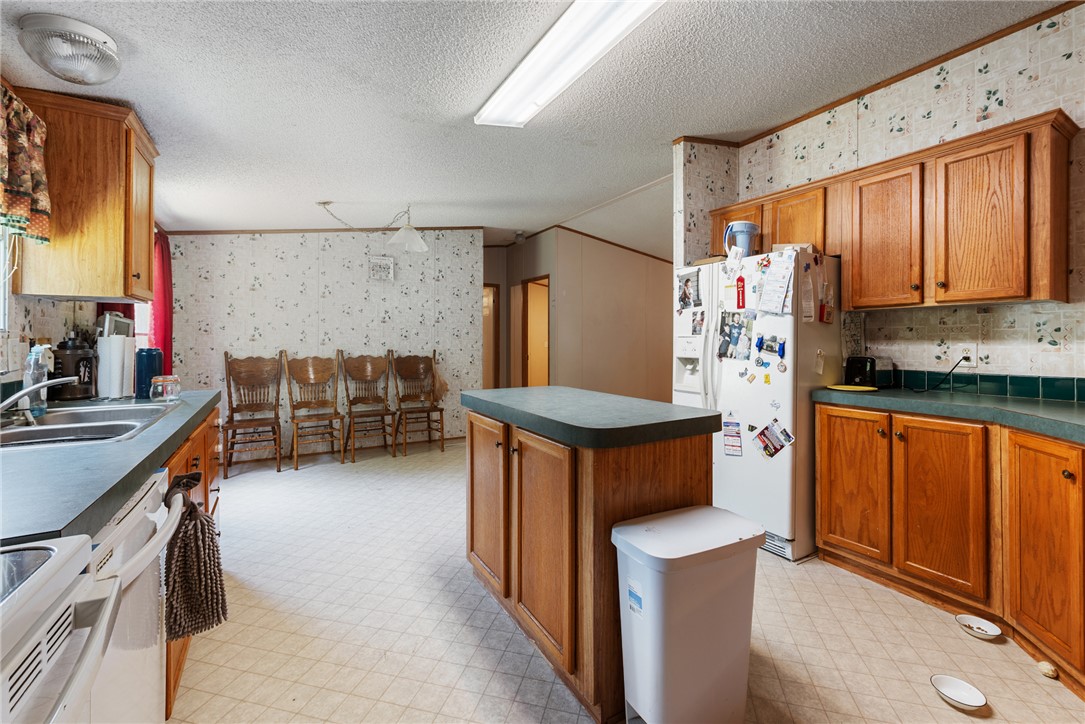 8277 Shady Lane Bryan, TX 77808 - Photo 8 of 21 a kitchen with stainless steel appliances a stove and a refrigerator