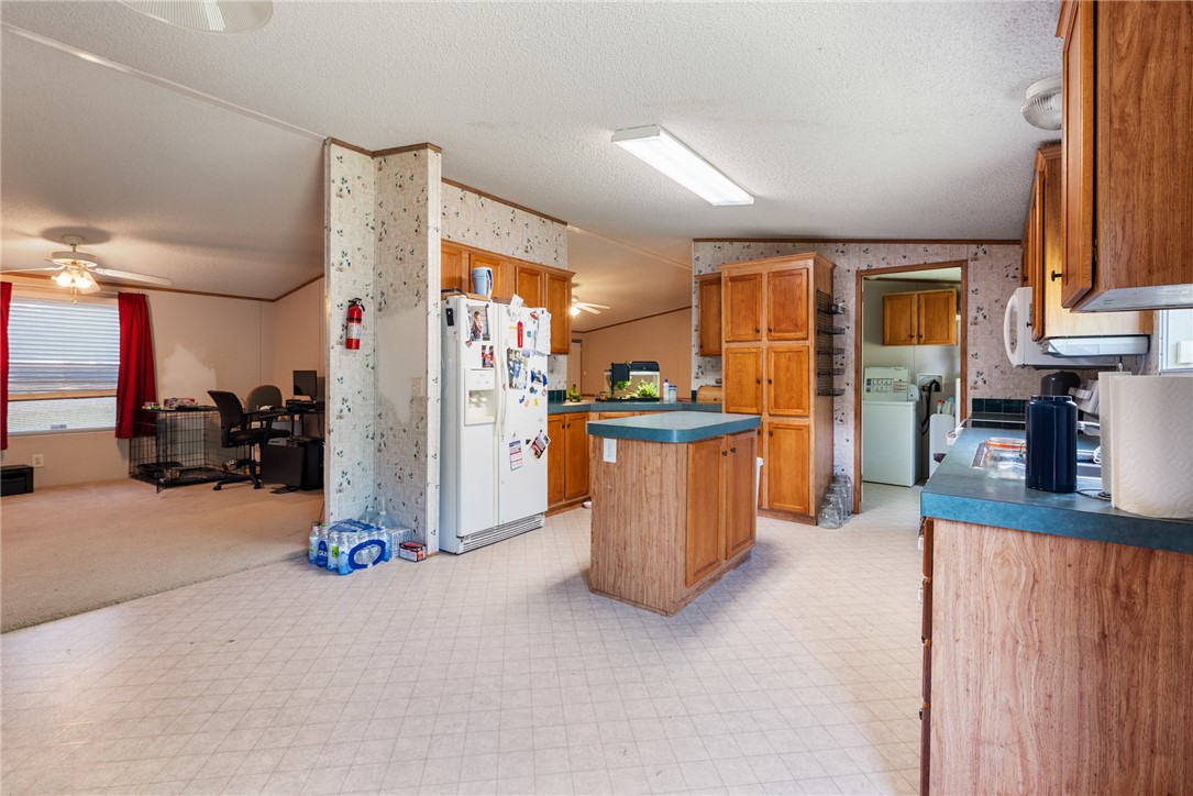 8277 Shady Lane Bryan, TX 77808 - Photo 9 of 21 a view of a kitchen with furniture and a kitchen