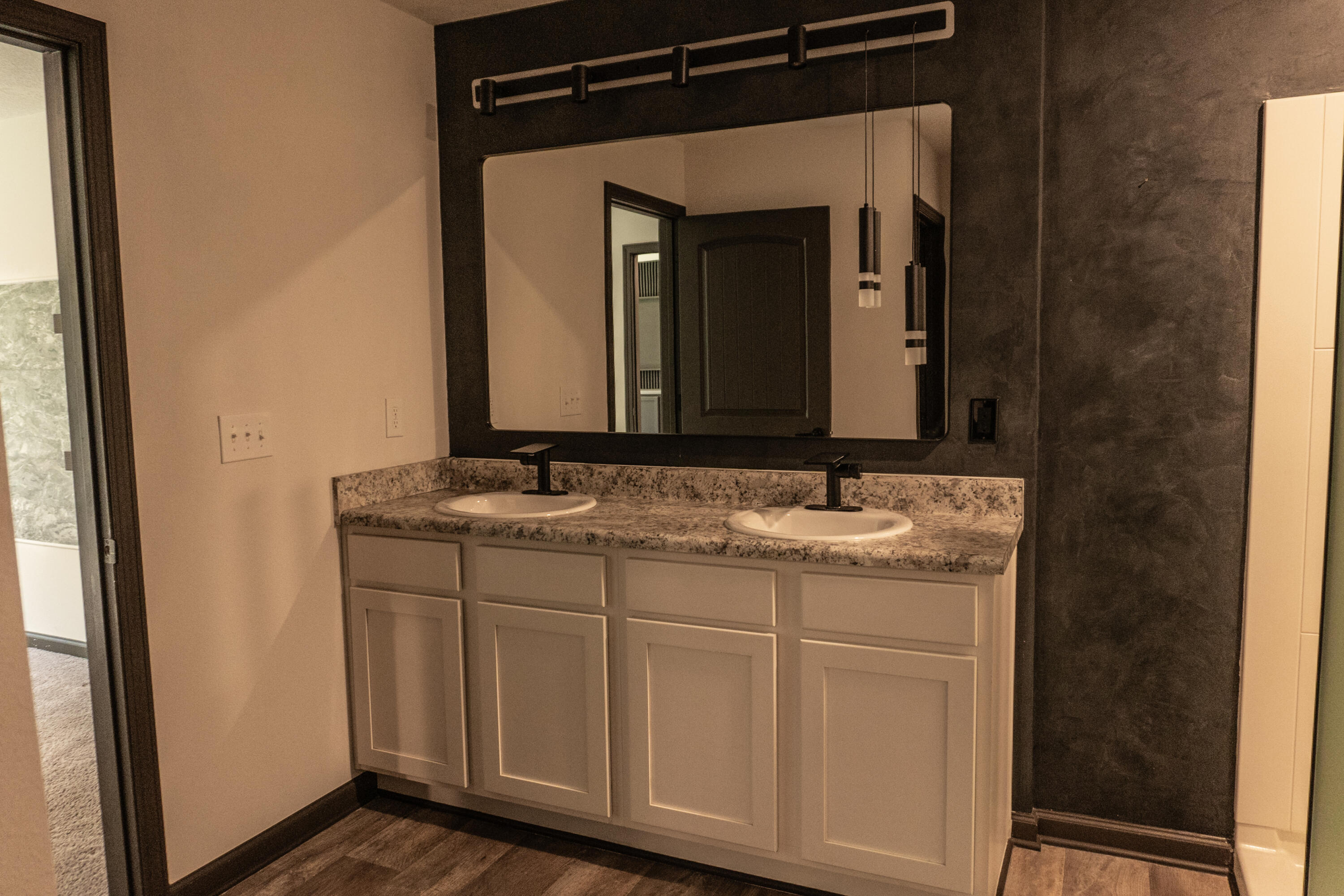 3476 Sparco Drive Crestview, FL 32539 - Photo 20 of 27 a bathroom with a granite countertop sink vanity and a mirror