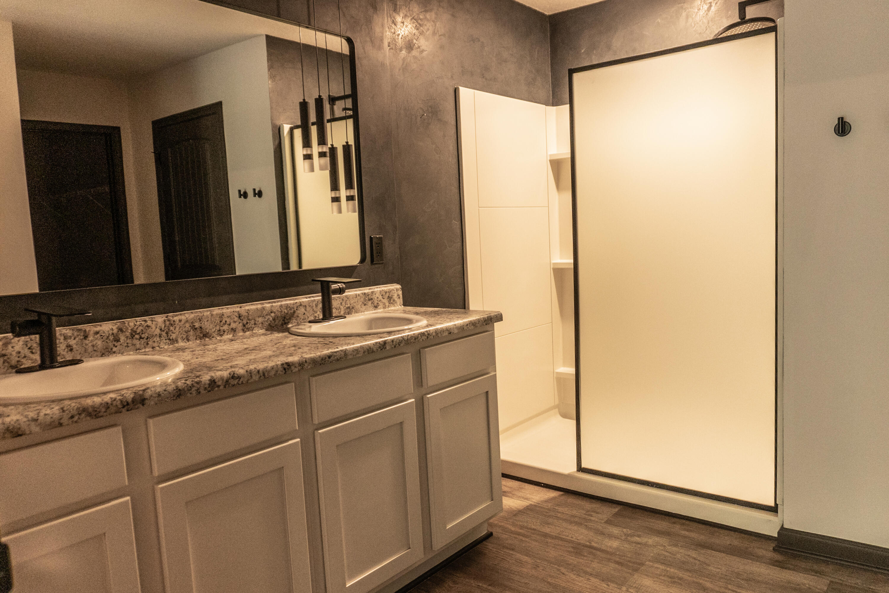 3476 Sparco Drive Crestview, FL 32539 - Photo 21 of 27 a bathroom with a double vanity sink and mirror