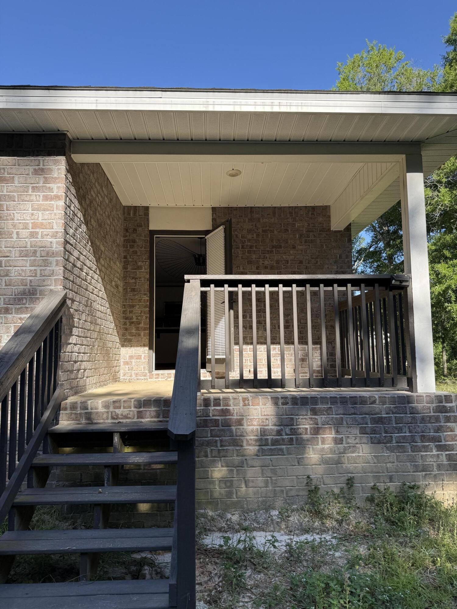 3476 Sparco Drive Crestview, FL 32539 - Photo 23 of 27 a view of entryway with wooden floor