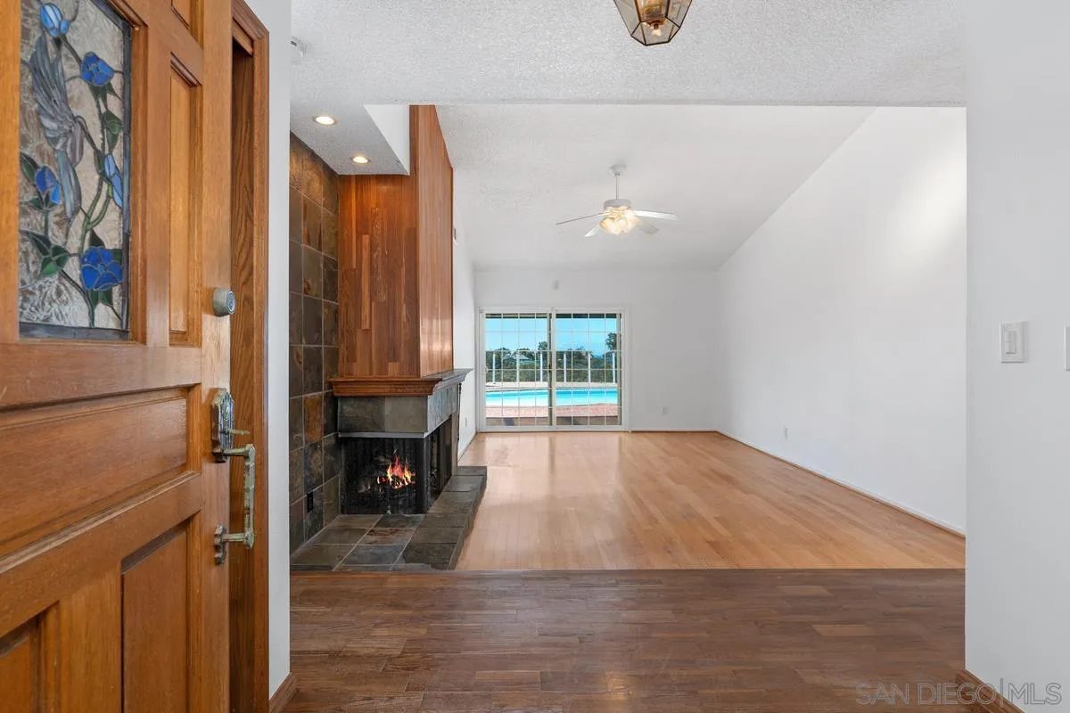 14186 Recuerdo Drive Del Mar, CA 92014 - Photo 12 of 35 a view of empty room with wooden floor and fan