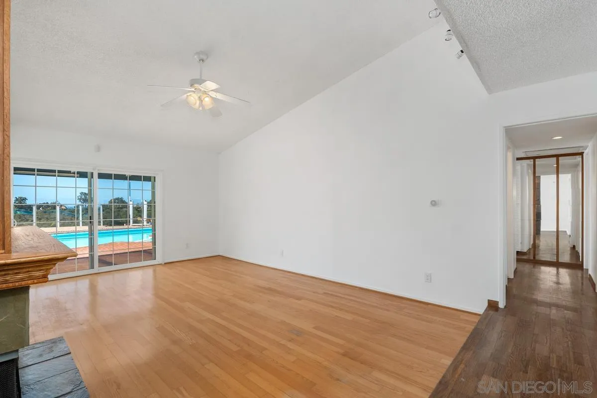 14186 Recuerdo Drive Del Mar, CA 92014 - Photo 16 of 35 wooden floor in an empty room with a window