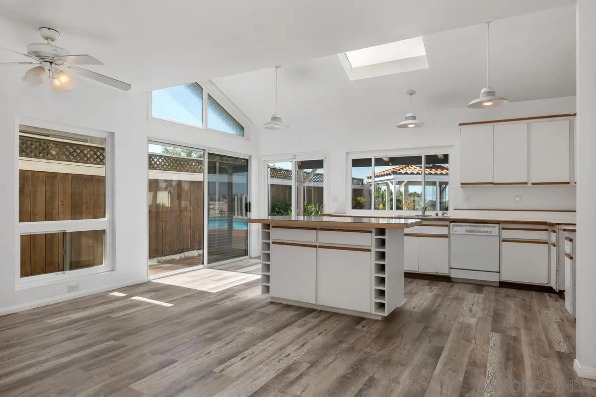 14186 Recuerdo Drive Del Mar, CA 92014 - Photo 17 of 35 a kitchen with granite countertop a stove a sink and a refrigerator