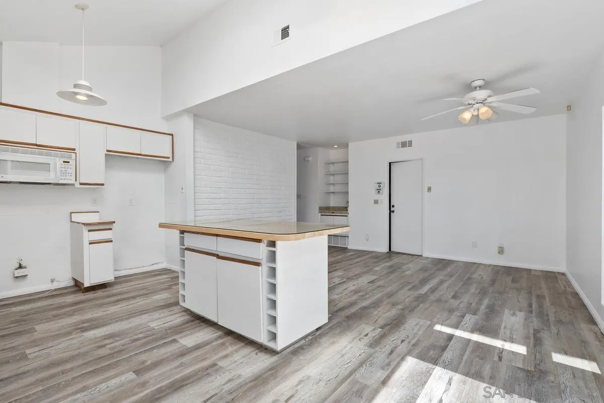 14186 Recuerdo Drive Del Mar, CA 92014 - Photo 19 of 35 a room with a dresser and chandelier