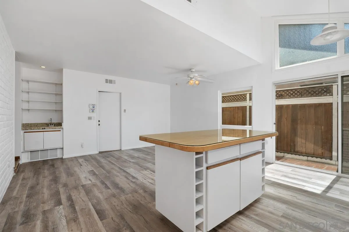 14186 Recuerdo Drive Del Mar, CA 92014 - Photo 21 of 35 a kitchen with a stove and a wooden floor