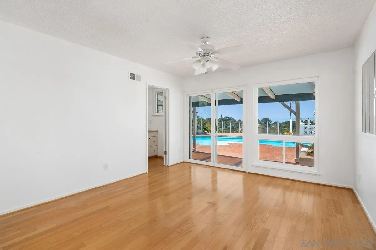 14186 Recuerdo Drive Del Mar, CA 92014 - Photo 28 of 35 wooden floor in an empty room with a window