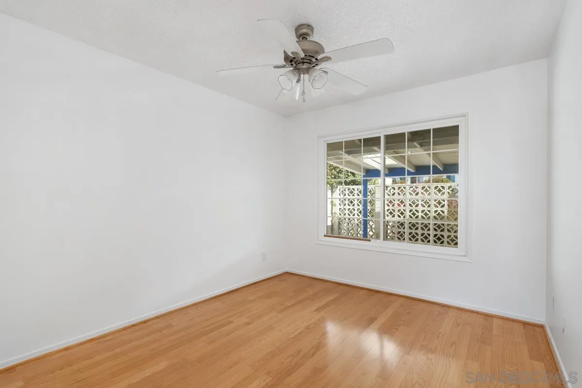 14186 Recuerdo Drive Del Mar, CA 92014 - Photo 33 of 35 an empty room with a window and a ceiling fan