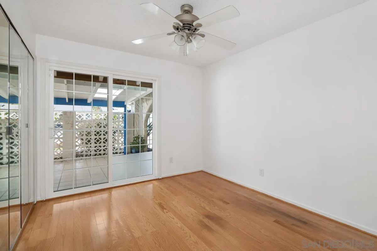 14186 Recuerdo Drive Del Mar, CA 92014 - Photo 34 of 35 an empty room with wooden floor and windows