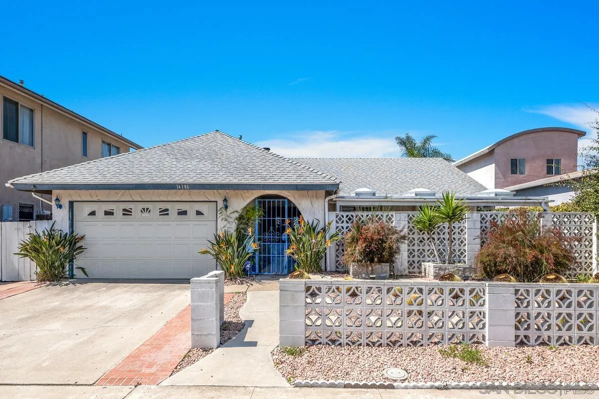 14186 Recuerdo Drive Del Mar, CA 92014 - Photo 6 of 35 a front view of a house with garden