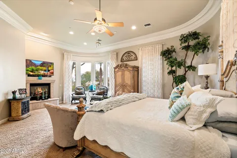 a view of a balcony with two chairs and a potted plant