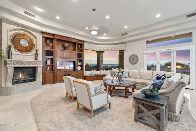 a view of a patio with table and chairs potted plants with wooden floor and fence