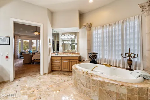 a view of a chairs and table in the balcony