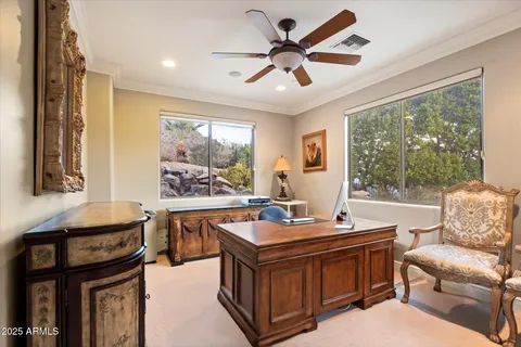 a view of a patio with table and chairs potted plants with wooden floor and fence