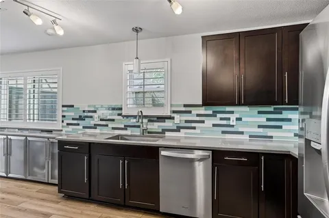 a kitchen with a sink and cabinets
