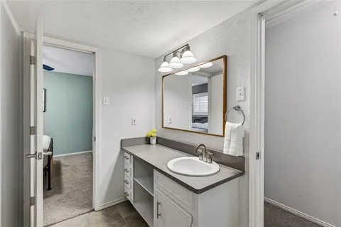 a bathroom with a sink and a mirror