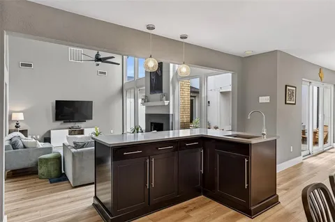 a kitchen with a sink and cabinets
