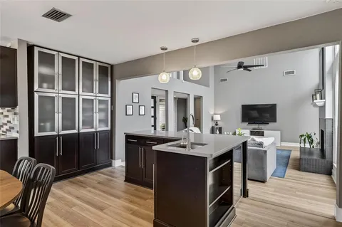 a open kitchen with stainless steel appliances granite countertop a sink stove and refrigerator