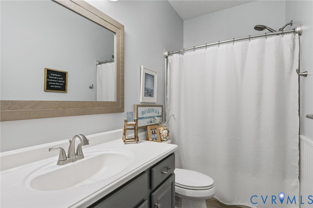 1755 Dispatch Road Quinton, VA 23141 - Photo 44 of 86 a bathroom with a sink toilet and a mirror
