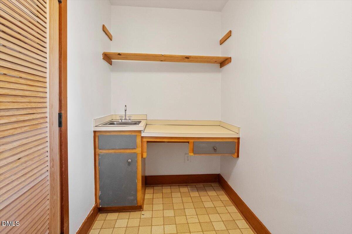 4805 Rembert Drive Raleigh, NC 27612 - Photo 18 of 45 a utility room with dryer and washer