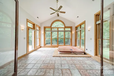a view of an entryway with a floor to ceiling window