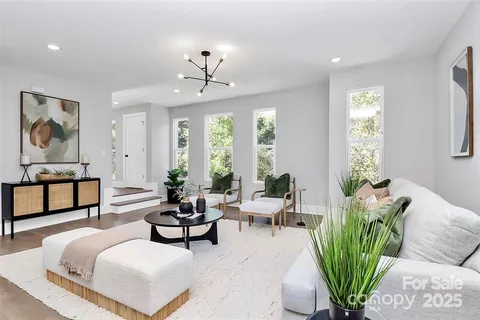 a living room with furniture and windows