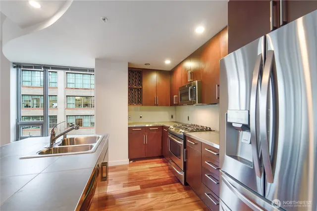 a kitchen that has a sink and a stove