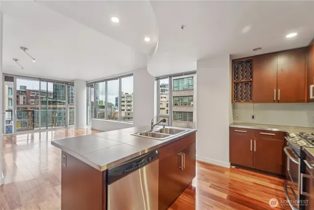 a view of hallway with wooden floor