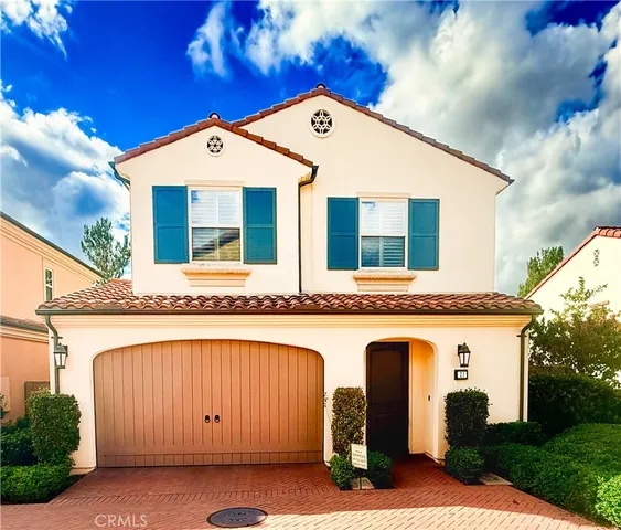 a front view of a house with garage