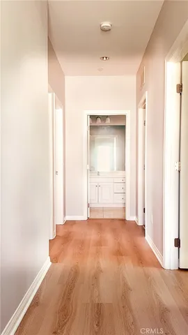 a view of an empty room and a window