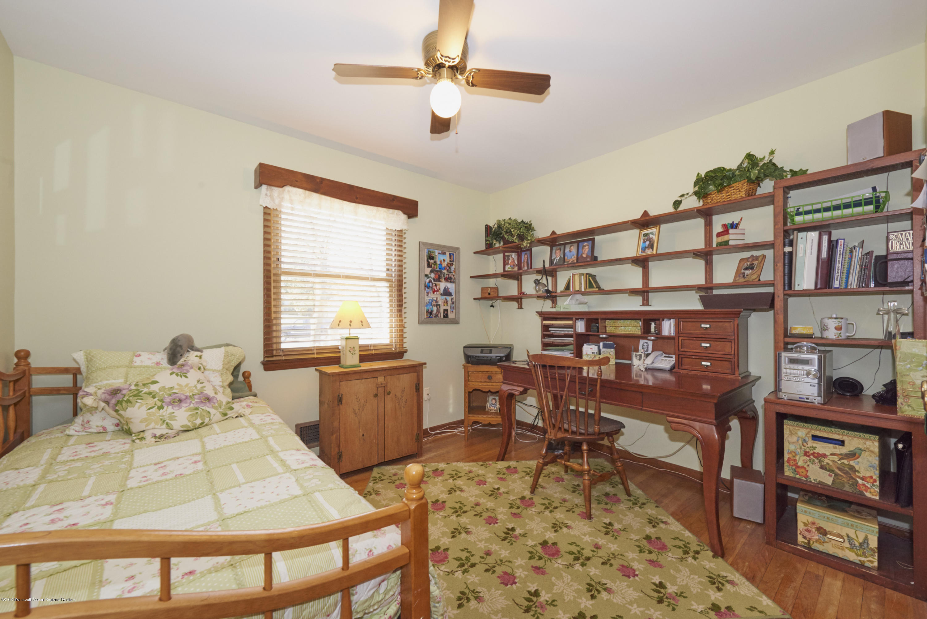 2 Hamilton Hill Road Lincroft, NJ 07738 - Photo 20 of 30 a living room with furniture and a book shelf