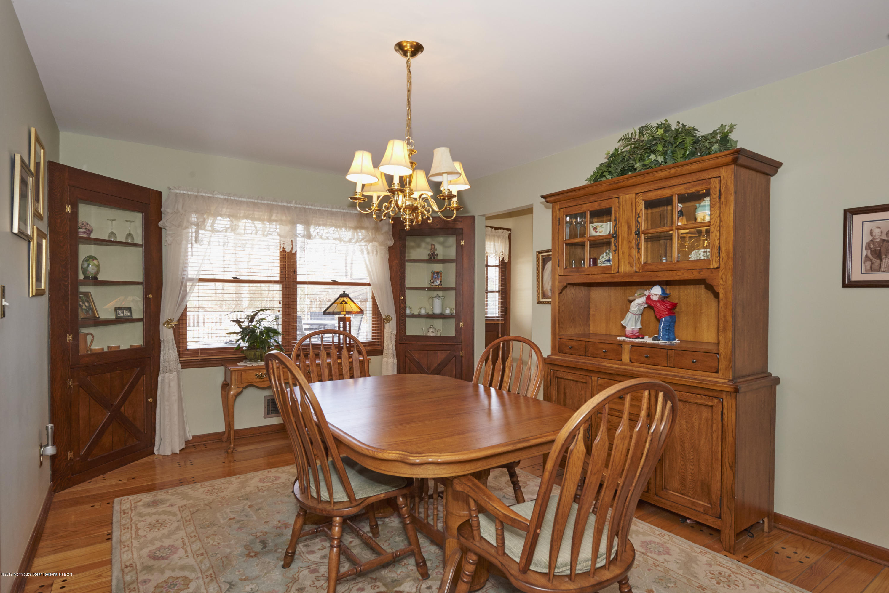 2 Hamilton Hill Road Lincroft, NJ 07738 - Photo 10 of 30 a view of a dining room with furniture a chandelier and wooden floor